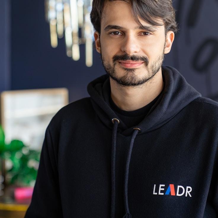 Kaveri Mehta, Lead Design Curator at MellowBridgeAtlas, reviewing corporate floral arrangements